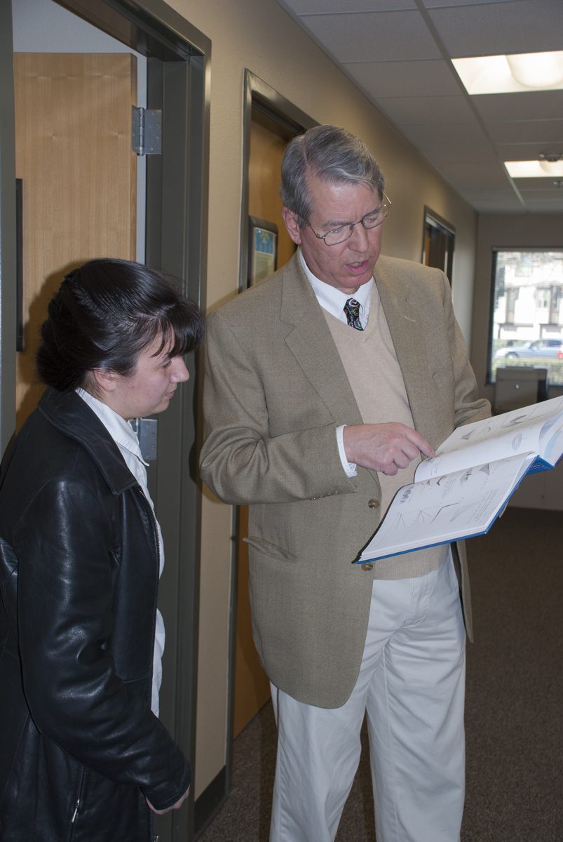 Anthony Barcellos, a math professor at ARC,  talks with a student about a math problem. (Photo courtesy of American River College)
