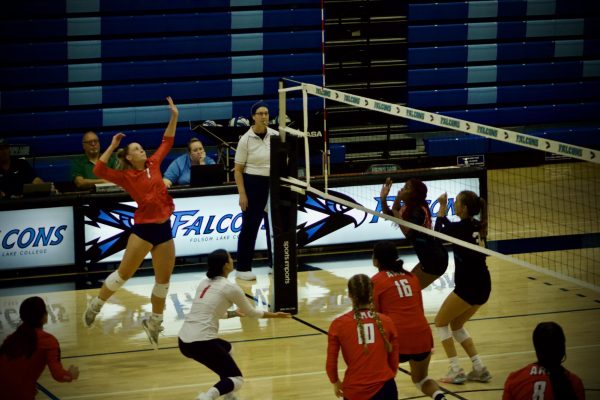 Cady Hatch goes up for a spike during the second set win at Folsom Lake College on Sept. 20. (Photo by Josh Zezzo).