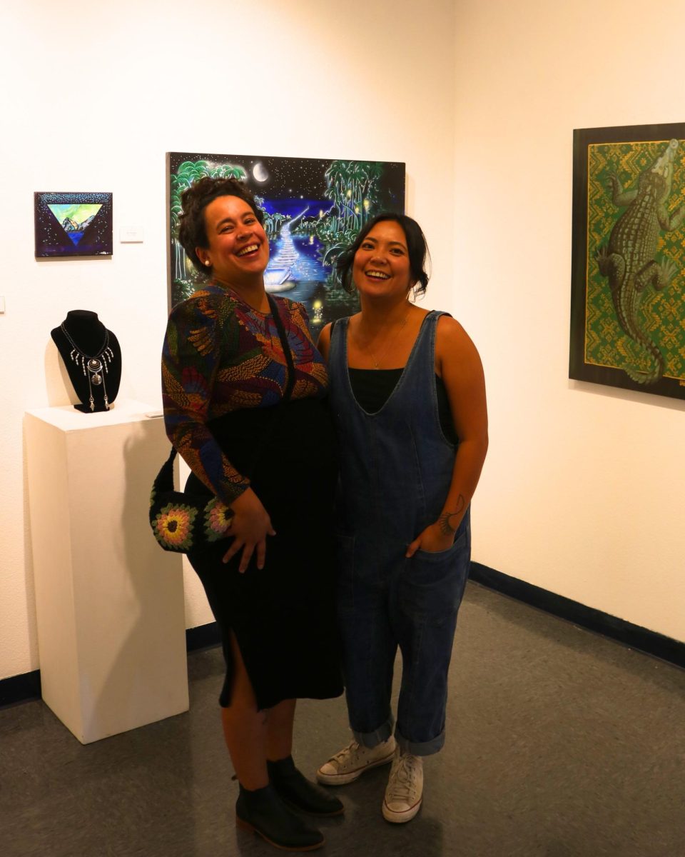 Guest curators Niki Toney (left) and Franceska Gamez (right) enjoy the success of their gallery introductions, while guests enjoy the diverse artistic displays. (Photo by Janelle Germain)